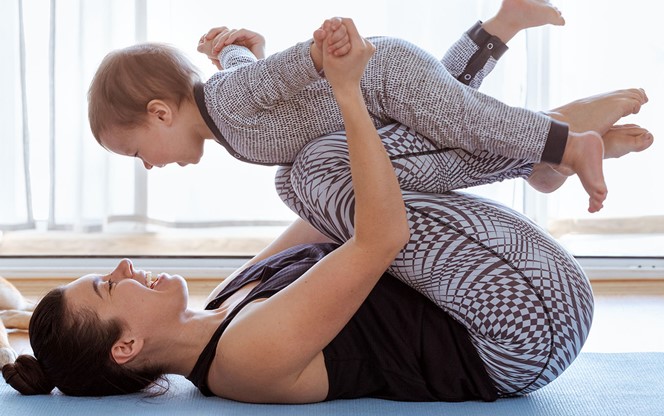 Mother and Child Exercising at Home