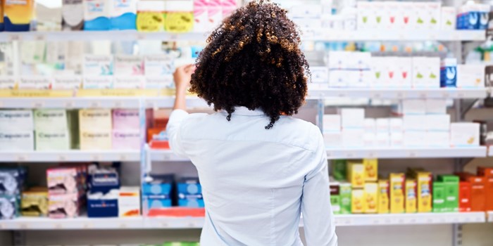Young Woman Looking At Products In A Pharmacy