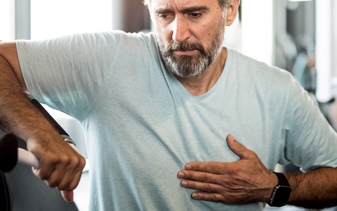 Man Feeling Chest Pain At The Gym