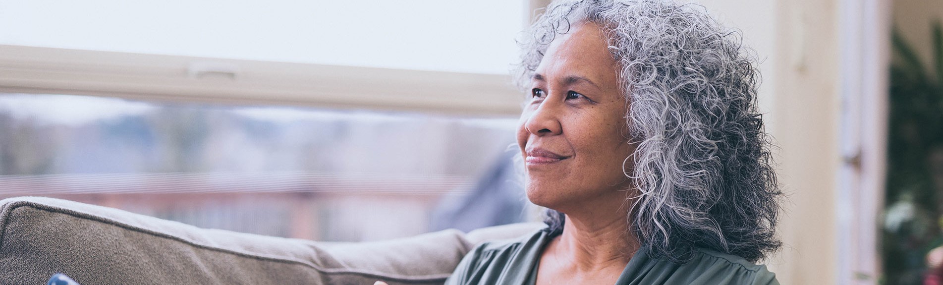 Mature Hawaiian Woman In The Early Morning With A Cup Of Tea And Contemplates The Day Ahead