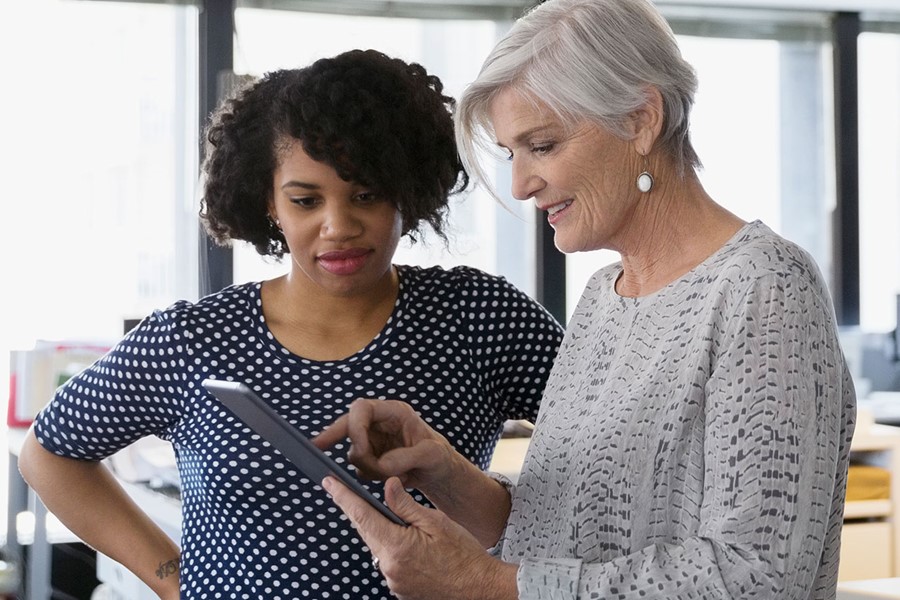 Designers Using Digital Tablet In Office