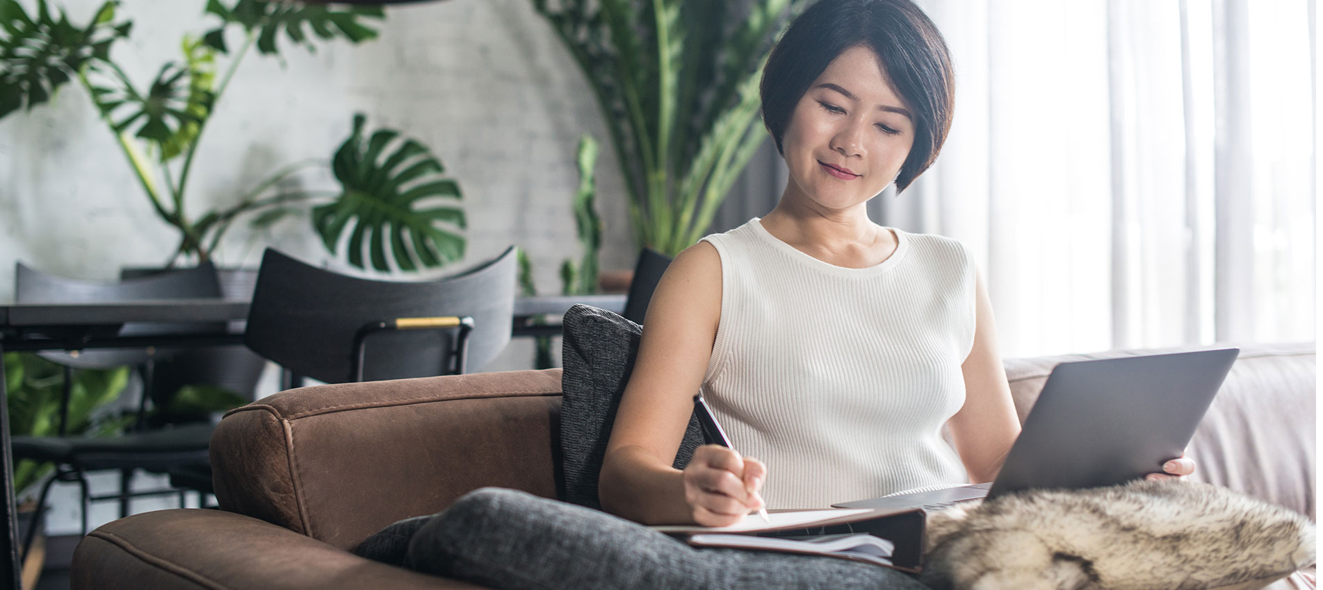 Happy Woman Using The Computer At Home