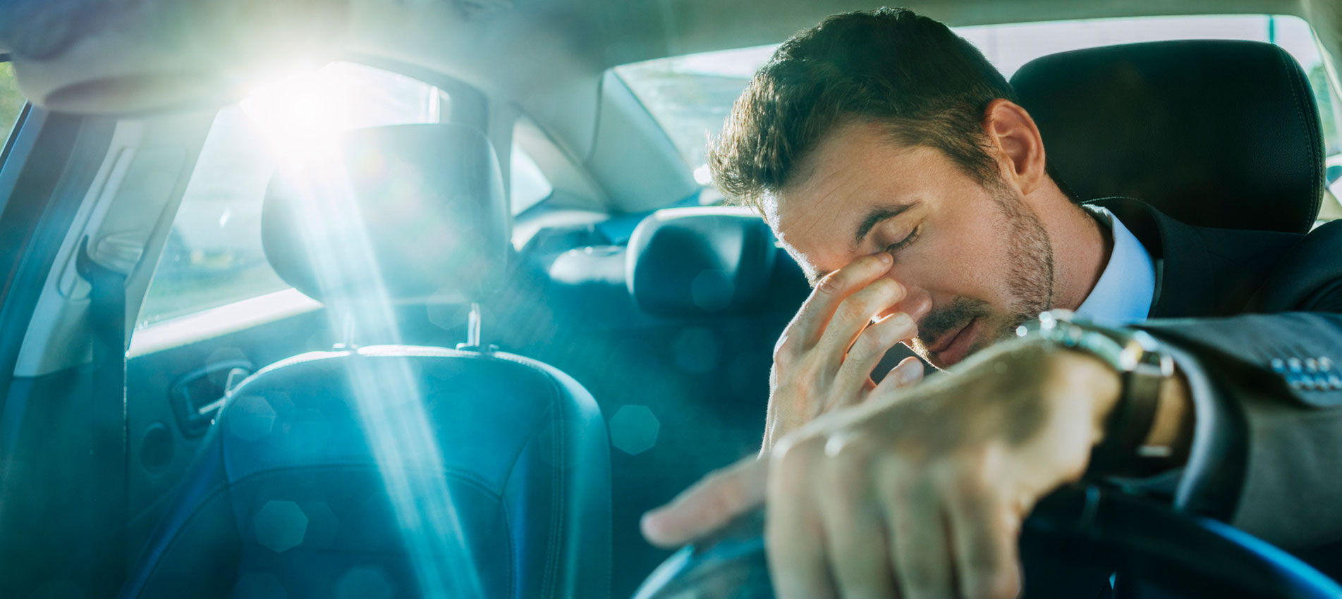 Man worrying in his car