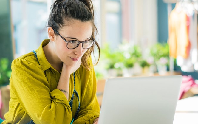 Girl looking at her laptop