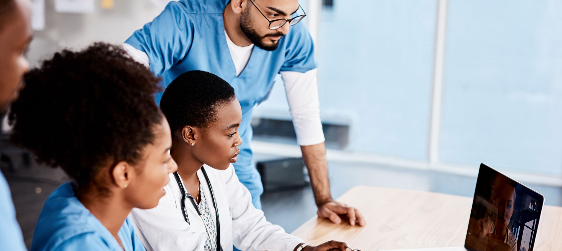 Shot of a group of young doctors having a video conference