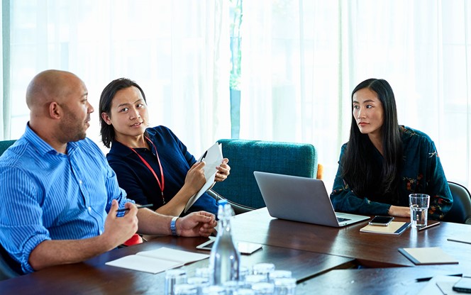 Trends Impacting the Workforce of the Future Team of professionals in discussion