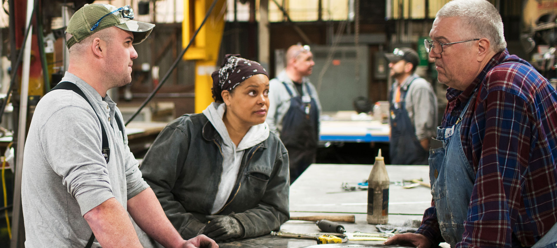 Workers Talking In Workshop