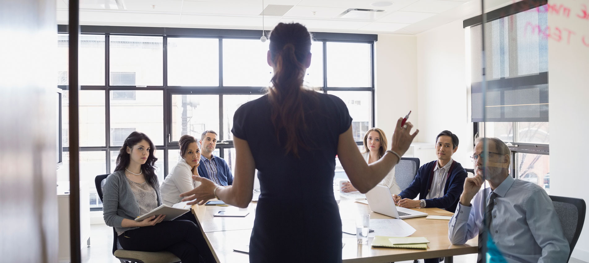 Businesswoman leading meeting in conference room