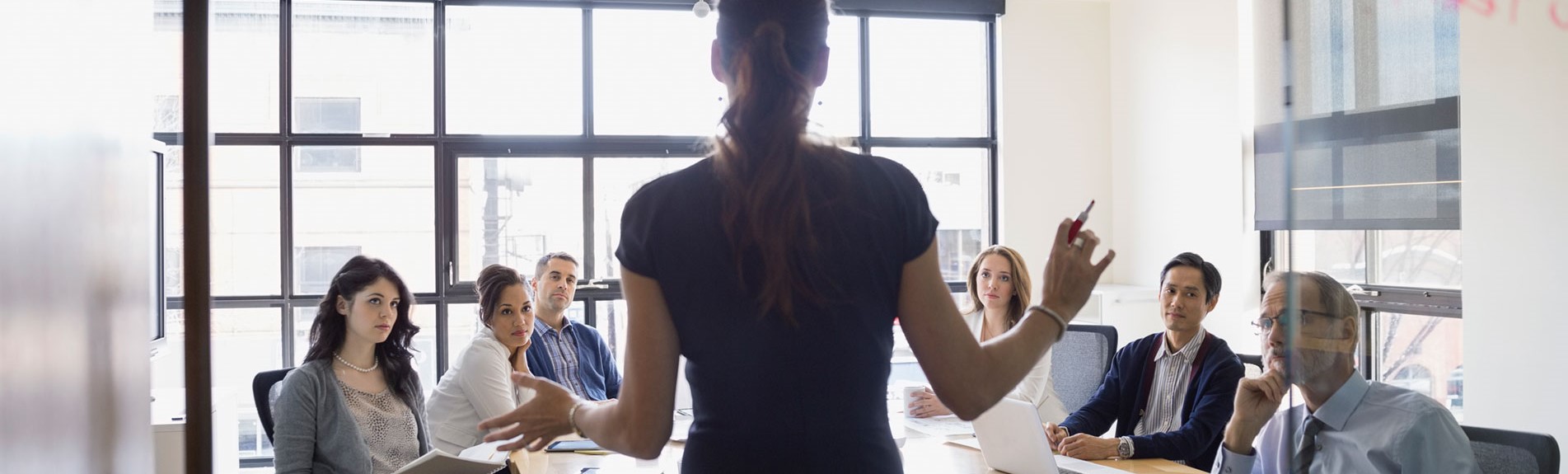 Businesswoman Leading Meeting In Conference Room