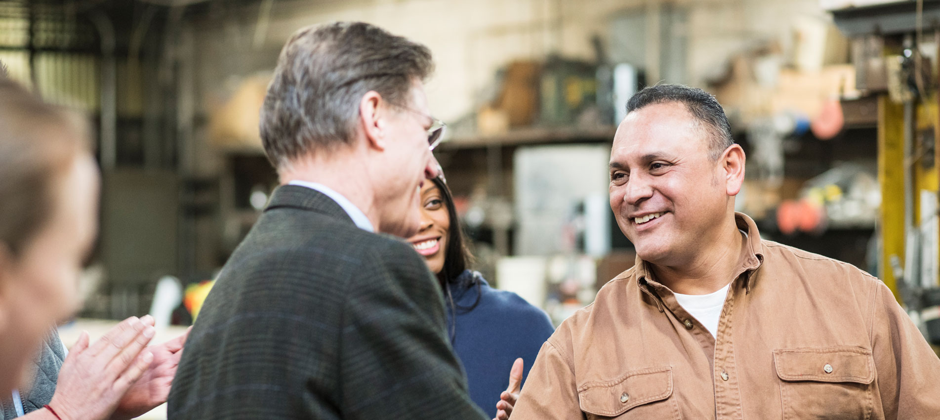 Worker Receiving Award In Workshop