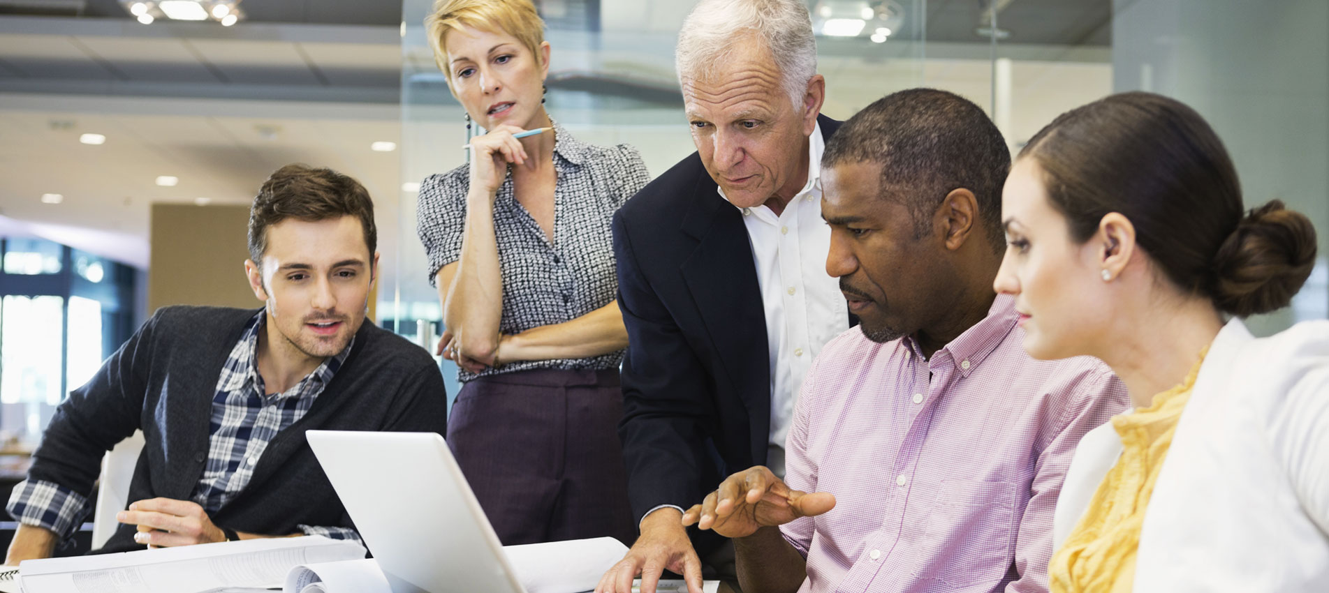 Business Colleagues Working On Laptop
