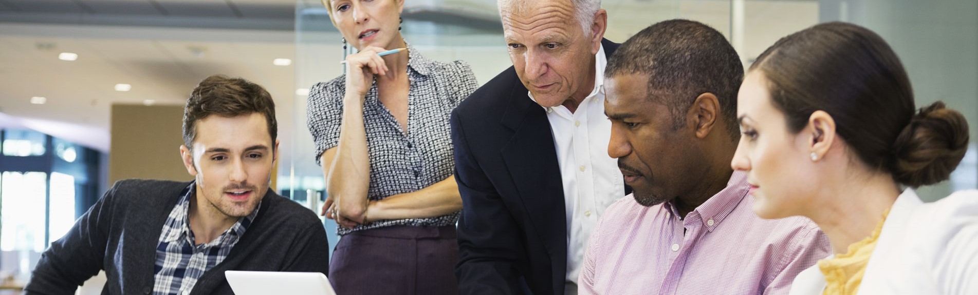 Business Colleagues Working On Laptop