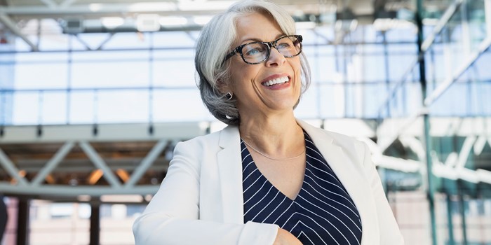 Smiling Businesswoman With In Atrium