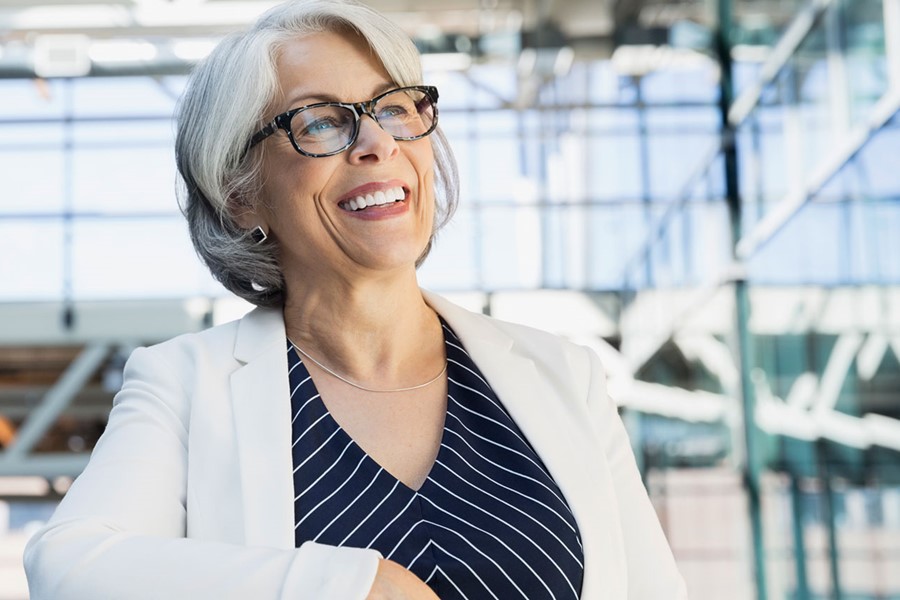 Smiling Businesswoman With In Atrium