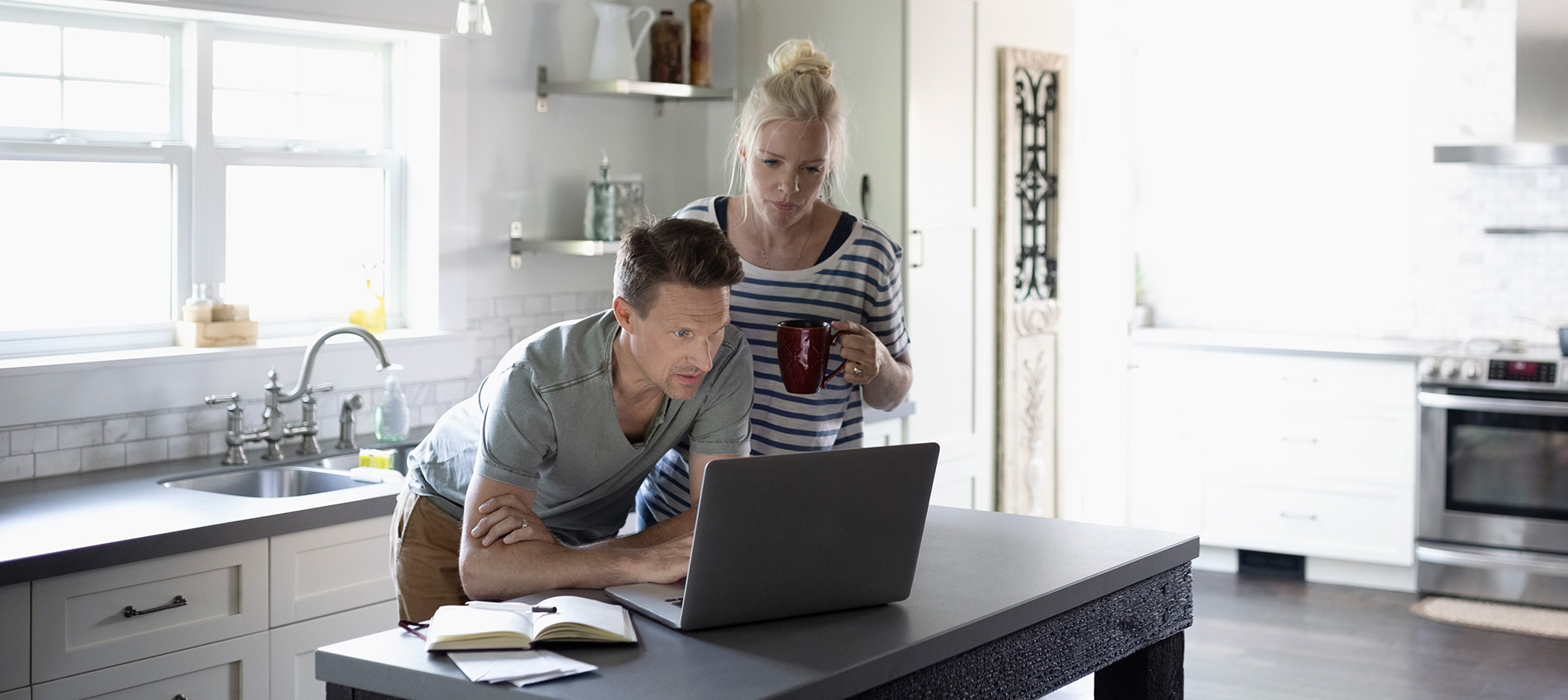 Couple Looking At A Laptop