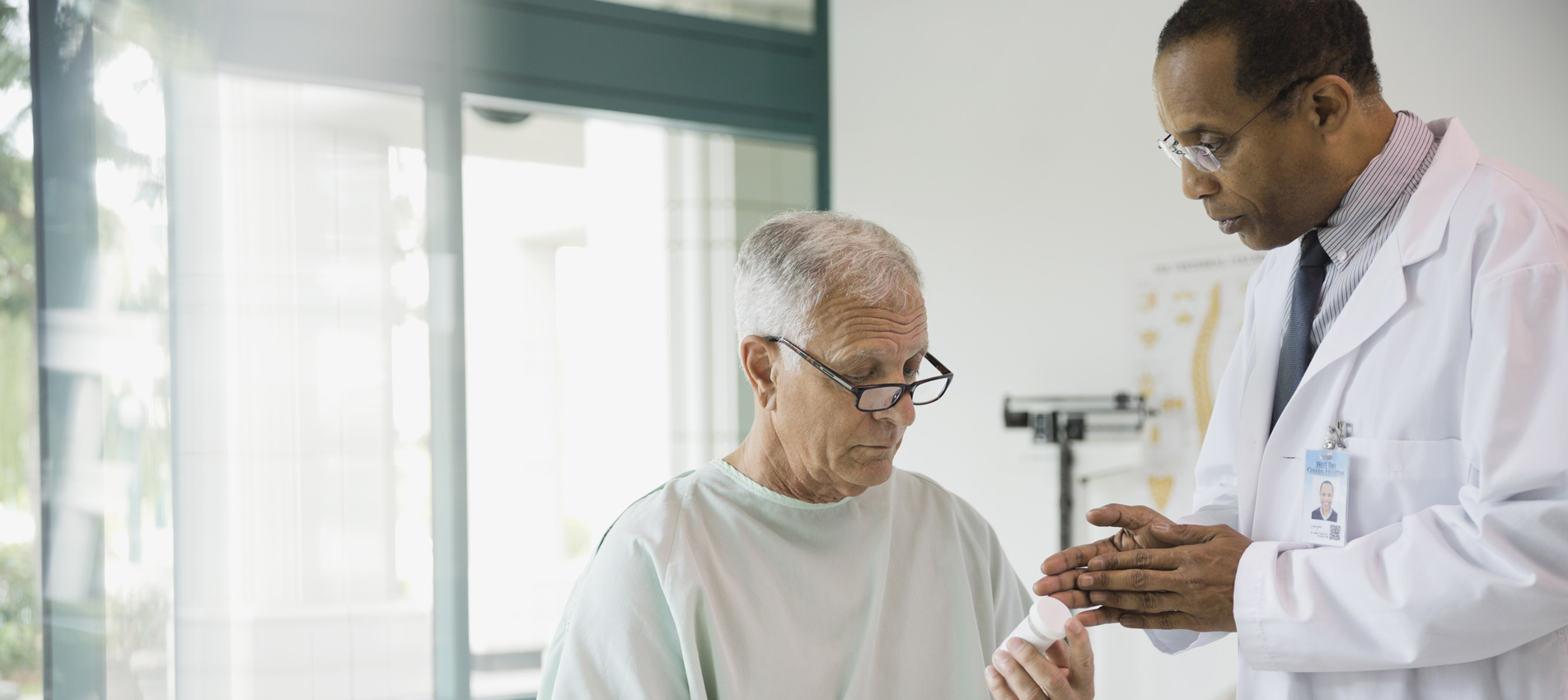 Doctor Explaining A Prescription To Patient