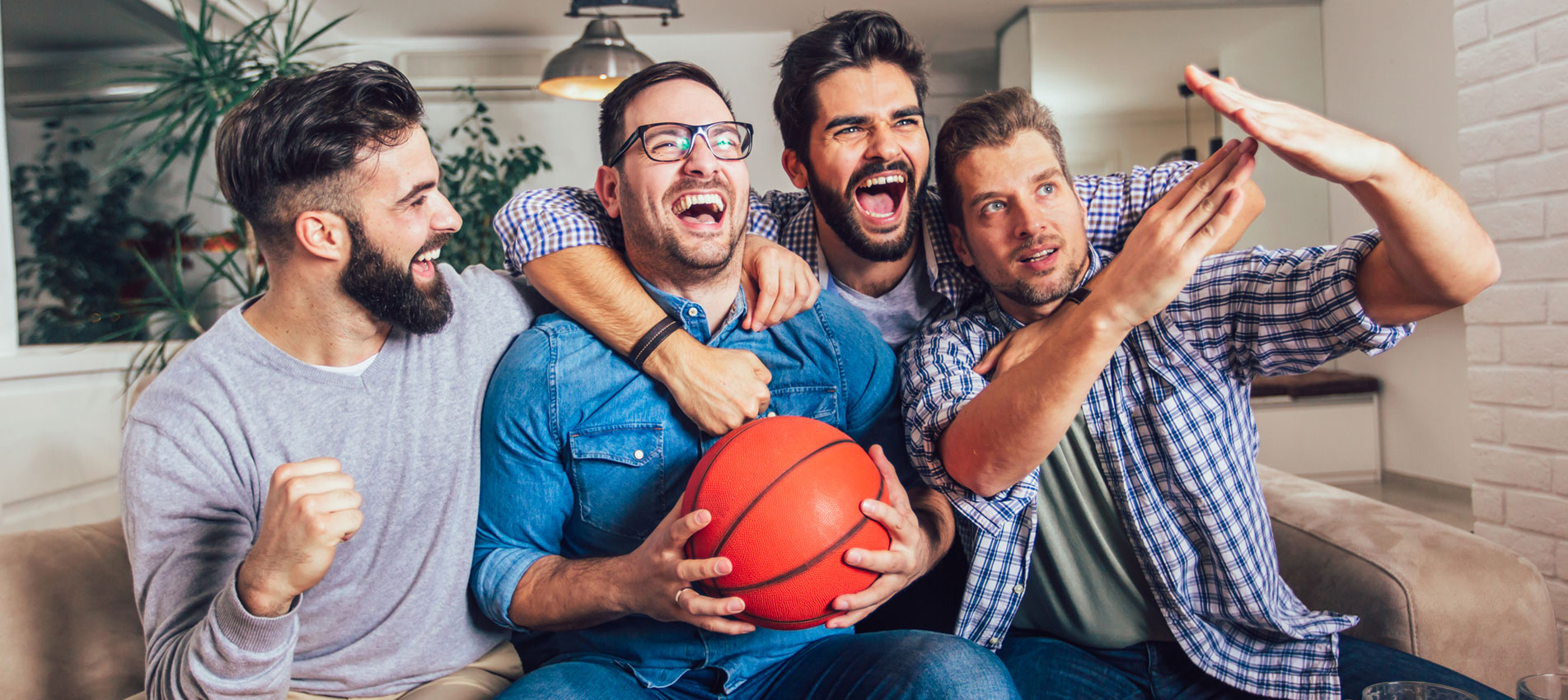 Happy Friends Or Basketball Fans Watching Basketball Game On Tv And Celebrating Victory