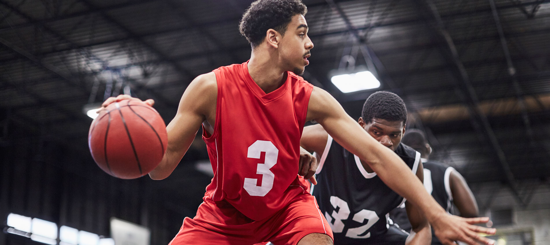 Young Basketball Player Dribbling The Ball