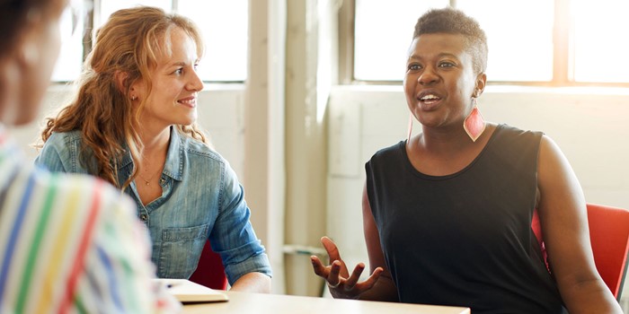 Unposed Group Of Creative Business People In An Open Concept