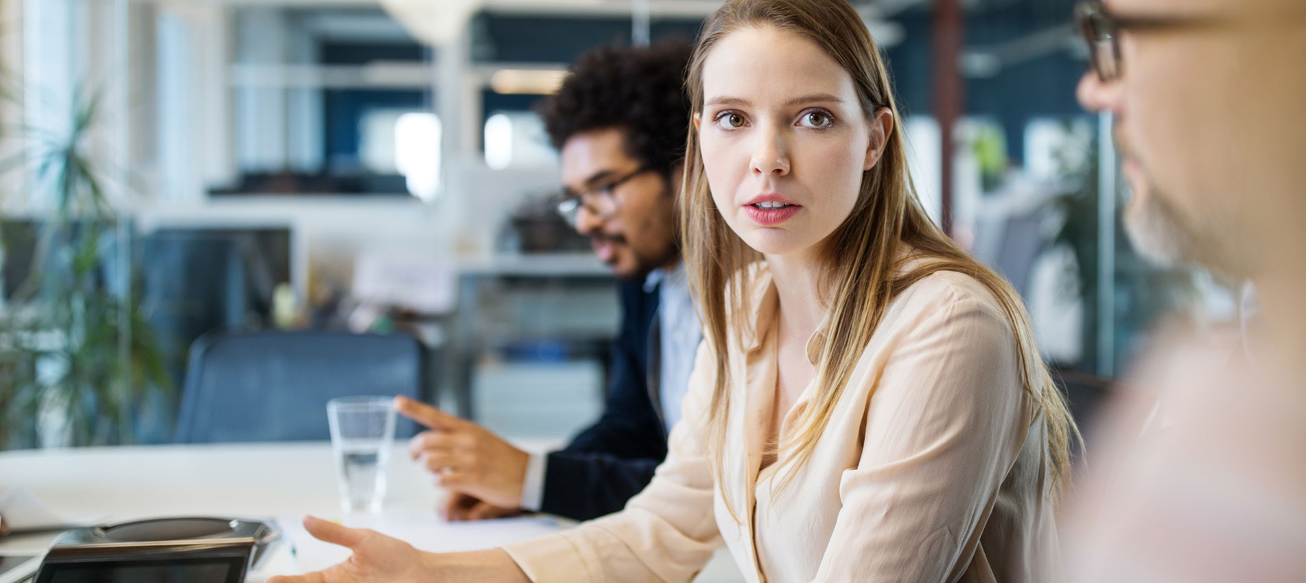 Businesswoman Talking With Coworkers In A Meeting
