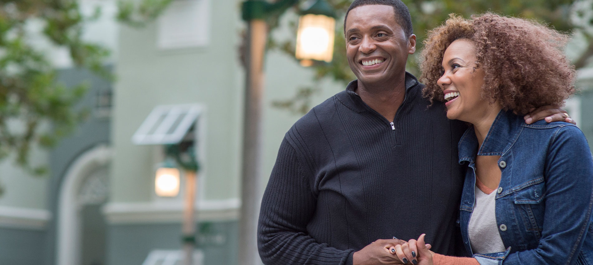 Smiling Couple Holding Hands Outdoors