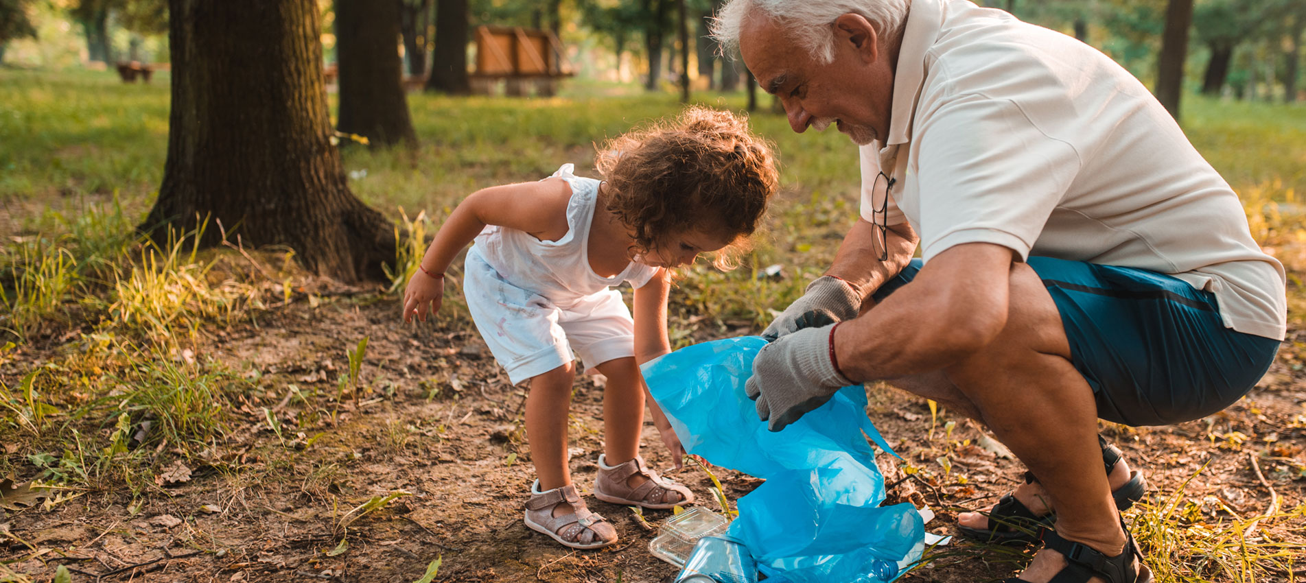 Grandpa And His Granddaughter Keeping The Environment Clean