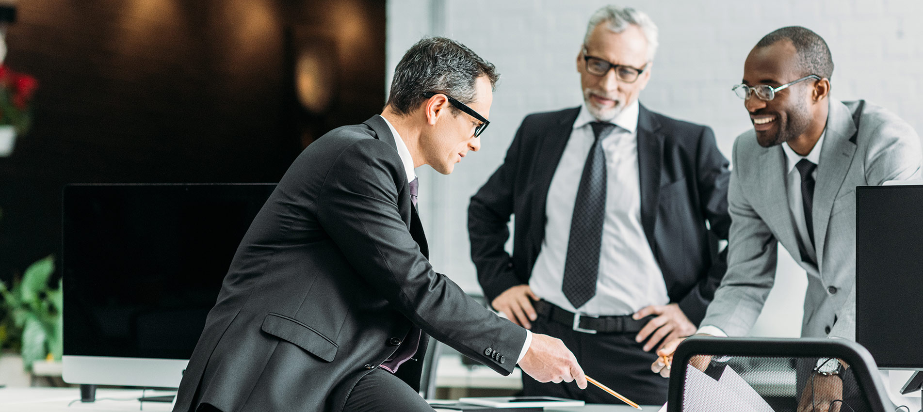 Businessmen Discussing In Office