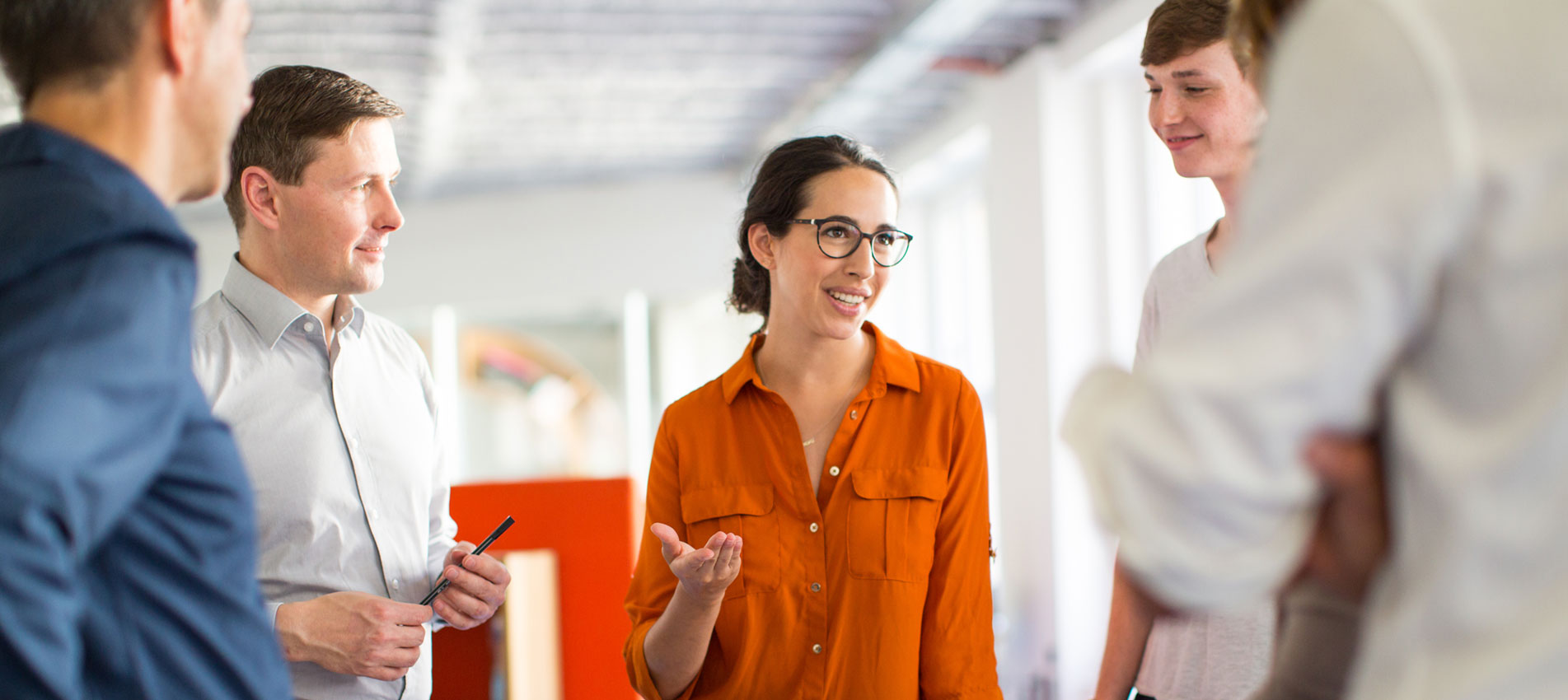 Professionals Meeting Around A Table