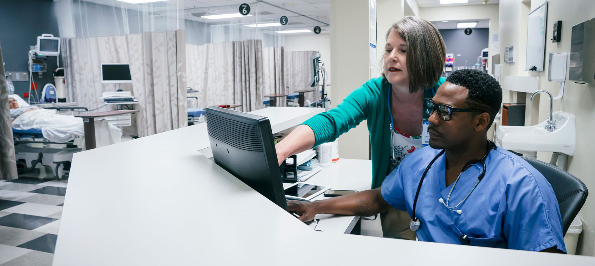 Doctor And Nurse Using Computer