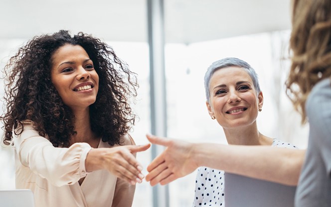 Businesswomen Shaking Hands At The Office