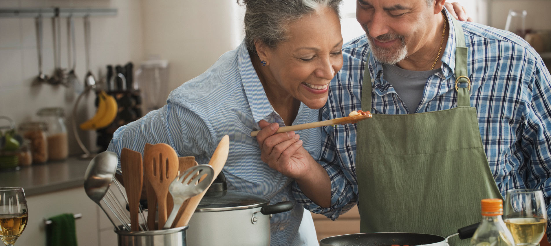 Couple Cooking In Kitchen