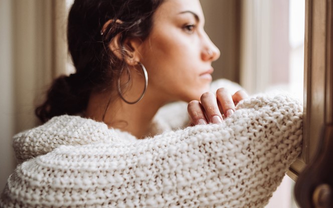 Woman Looking Outside The Window