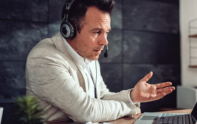 Businessman Having Online Meeting In His Office