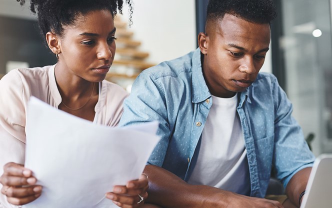 Couple Going Through Paperwork