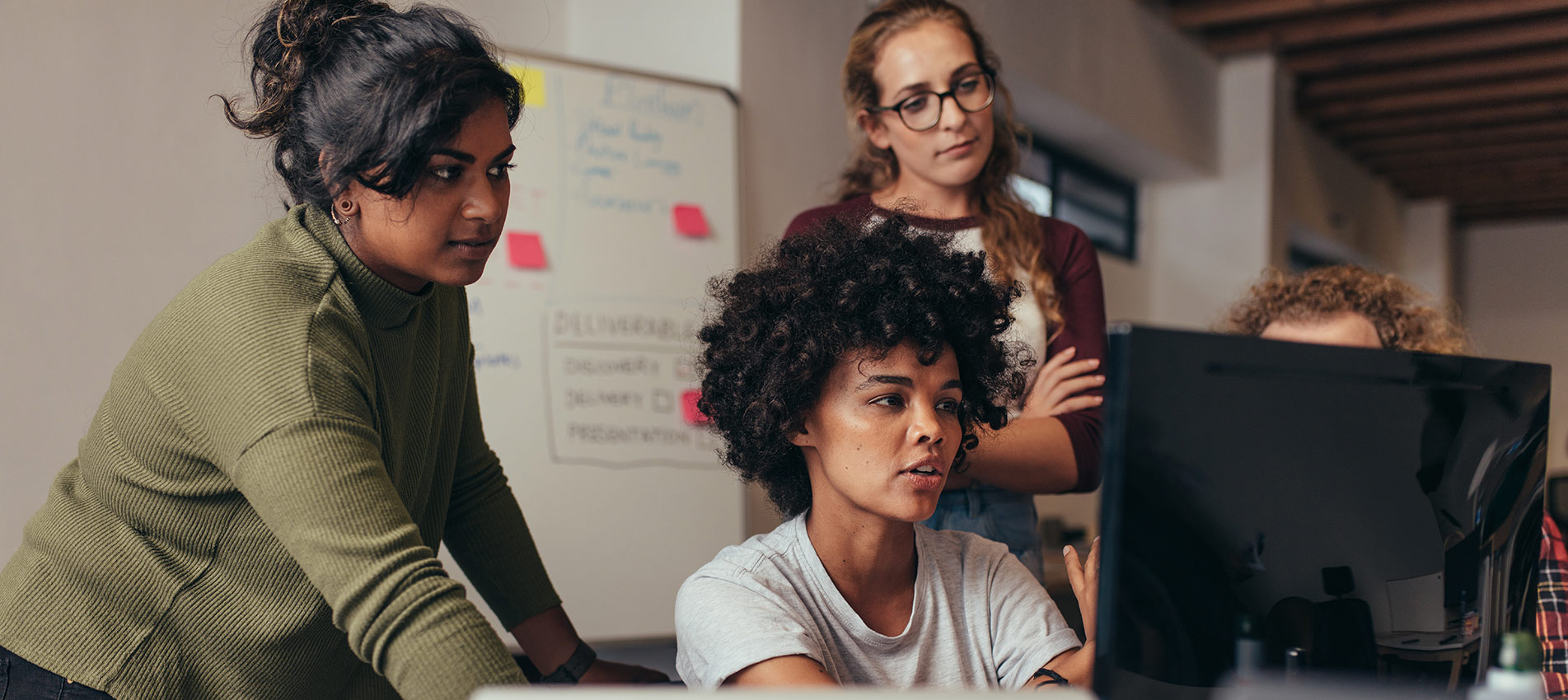 Female Software Engineers Working On Project Together