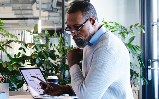 African American Man Working In Modern Office