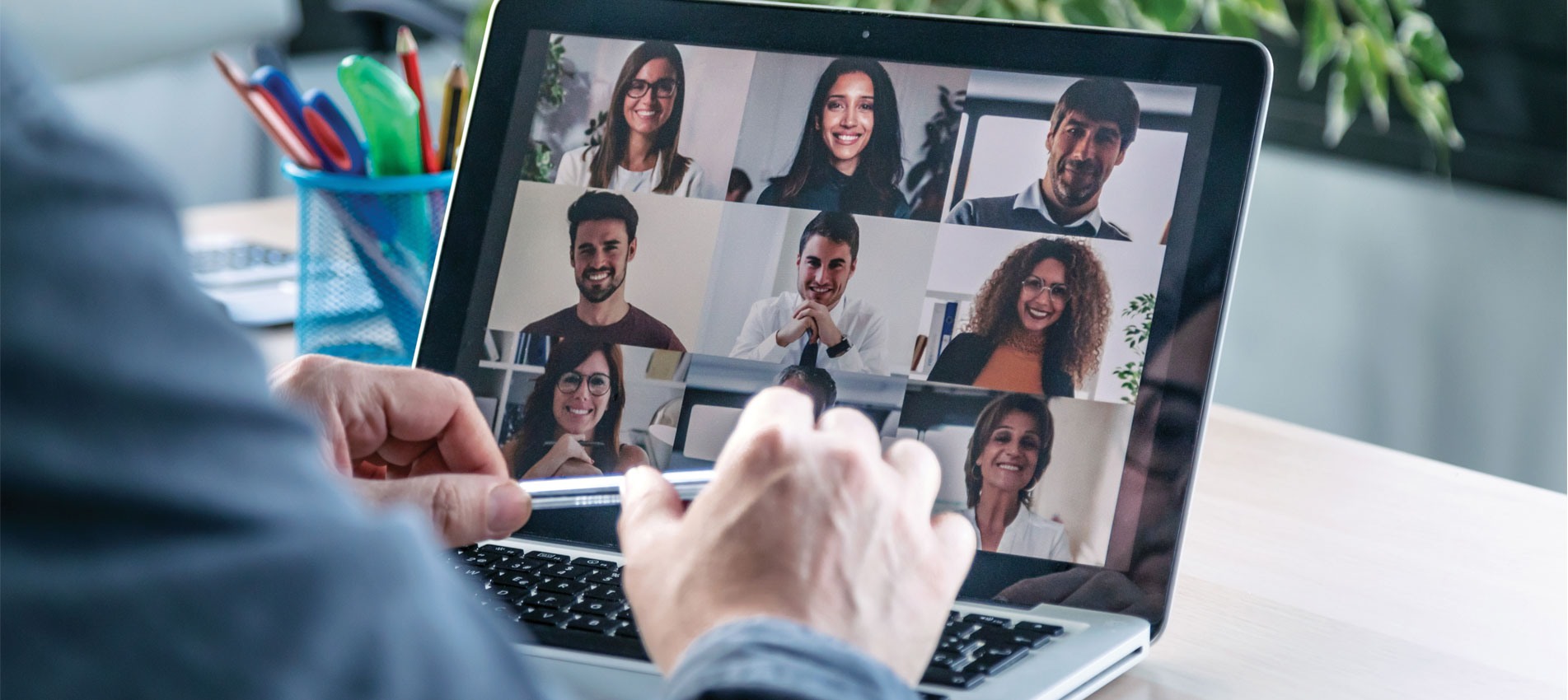 Businessman man chatting with colleagues online on a laptop