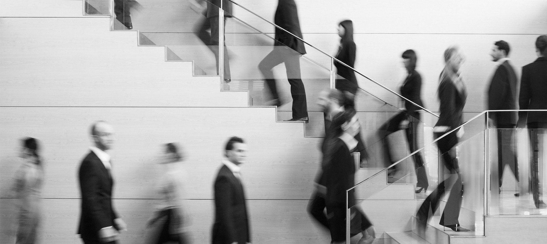 Business people walking up and down the stairs in the office building