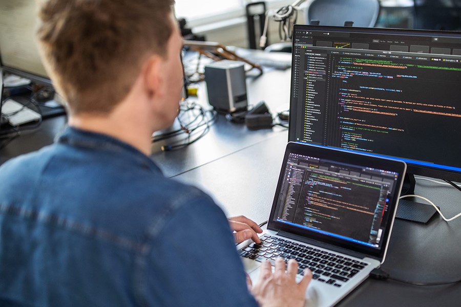 Computer Programmer Working On New Software Program