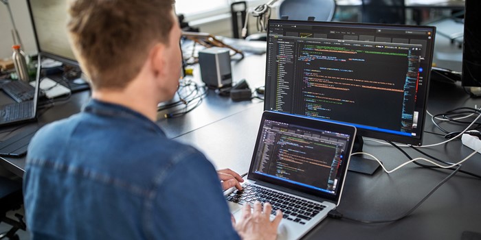 Computer Programmer Working On New Software Program