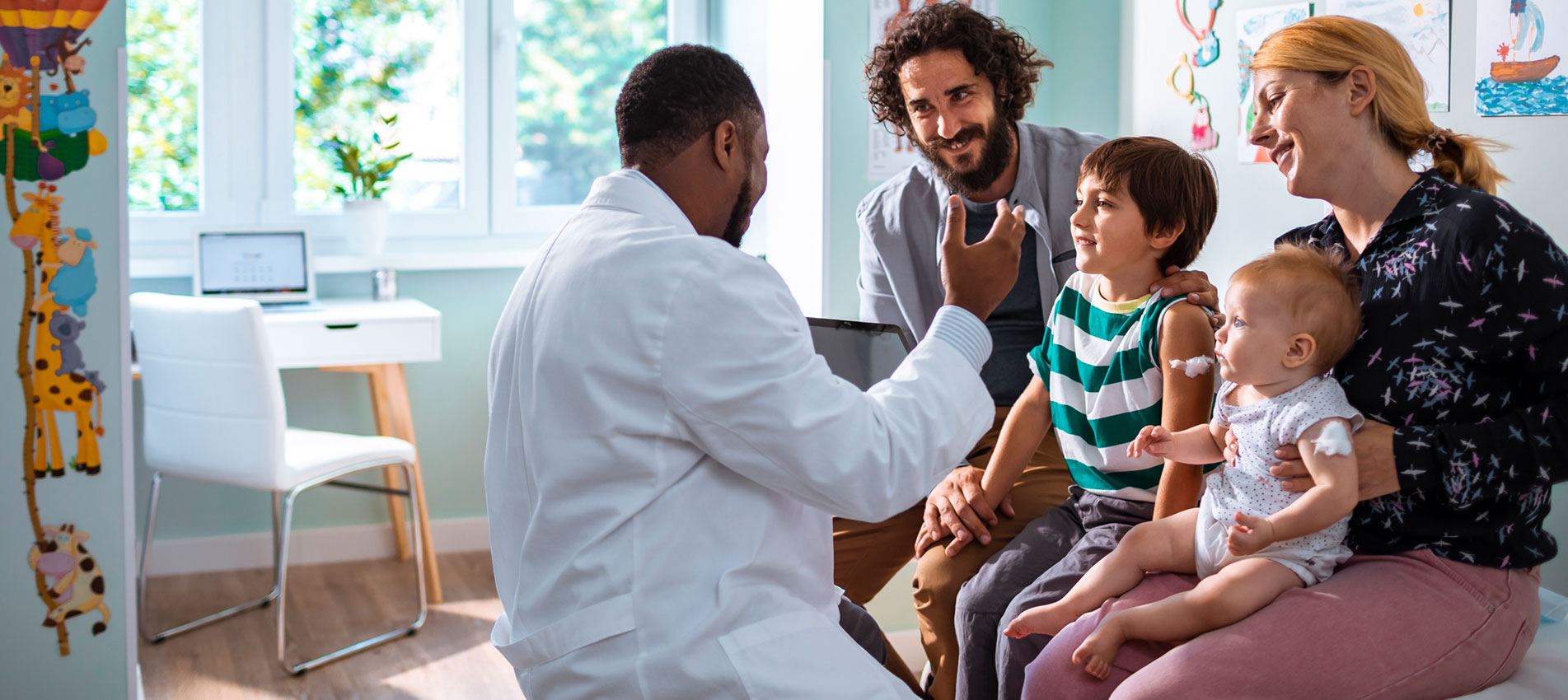 Close Up Of A Young Family At A Pediatricians Office
