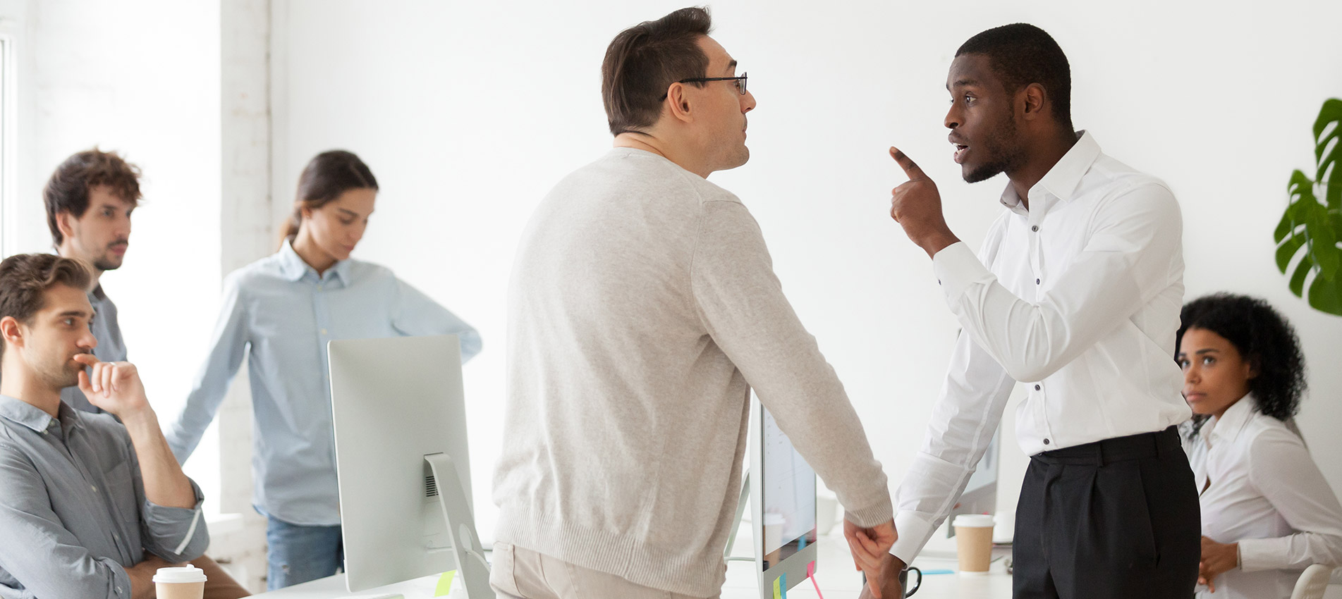 Angry Black Worker Disputing With Older Caucasian Colleague