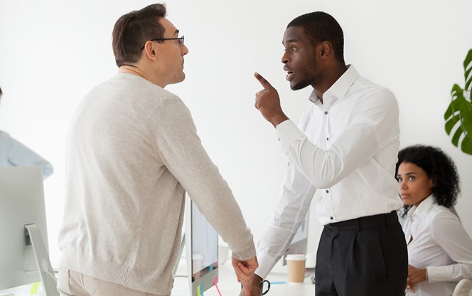 Angry Black Worker Disputing With Older Caucasian Colleague