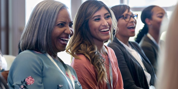 Diverse Group Of Women Enjoy A Hearty Laugh During A Session