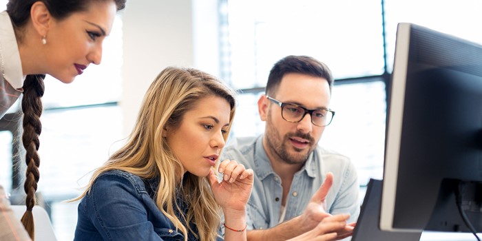 Group Of Business People And Software Developers Working As A Team In Office