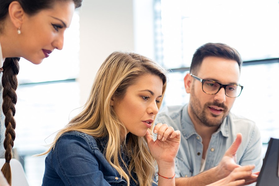Group Of Business People And Software Developers Working As A Team In Office
