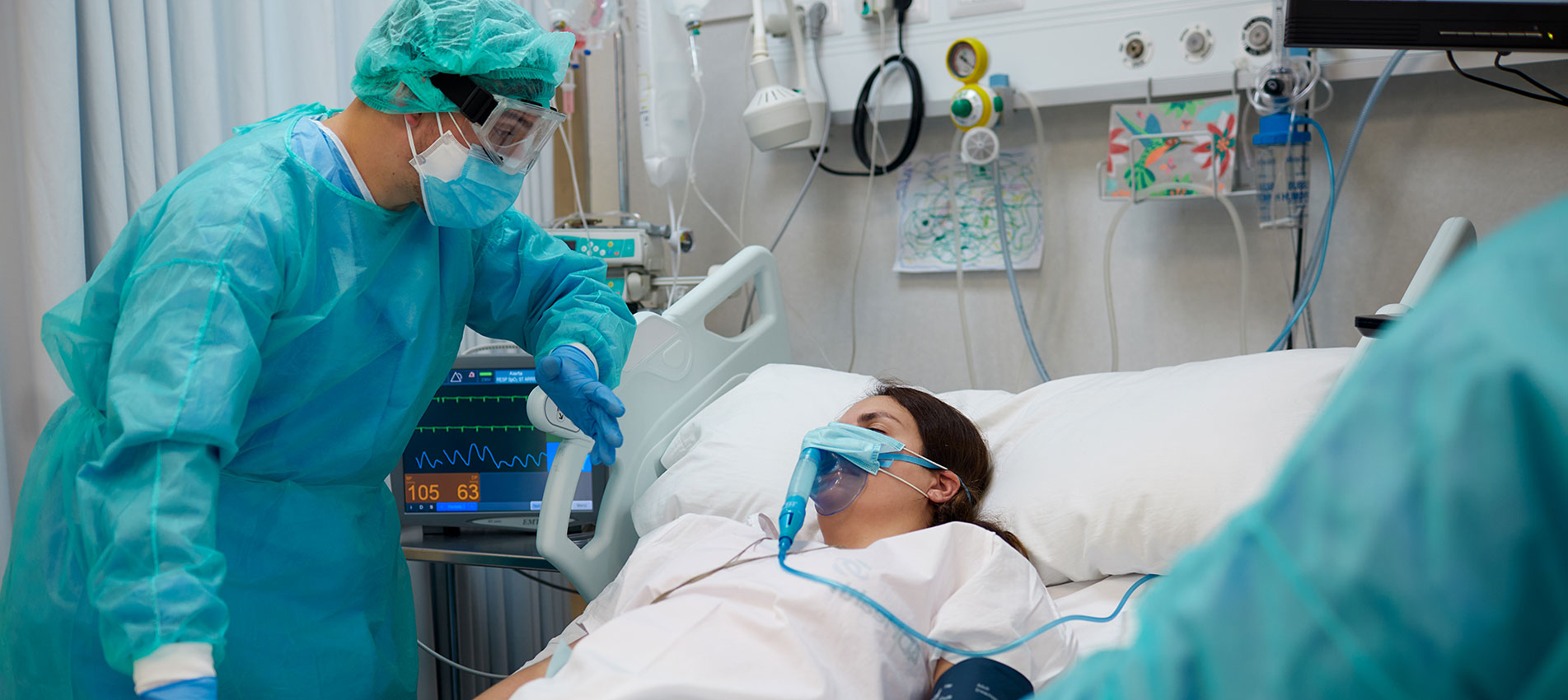Nurse Is Comforting A Covid Patient At The ICU