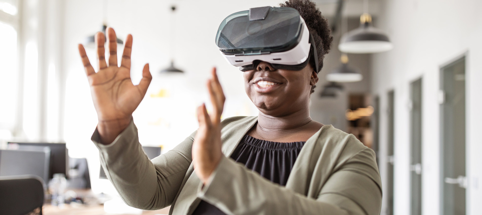 Happy African Using Virtual Reality Glasses In Office