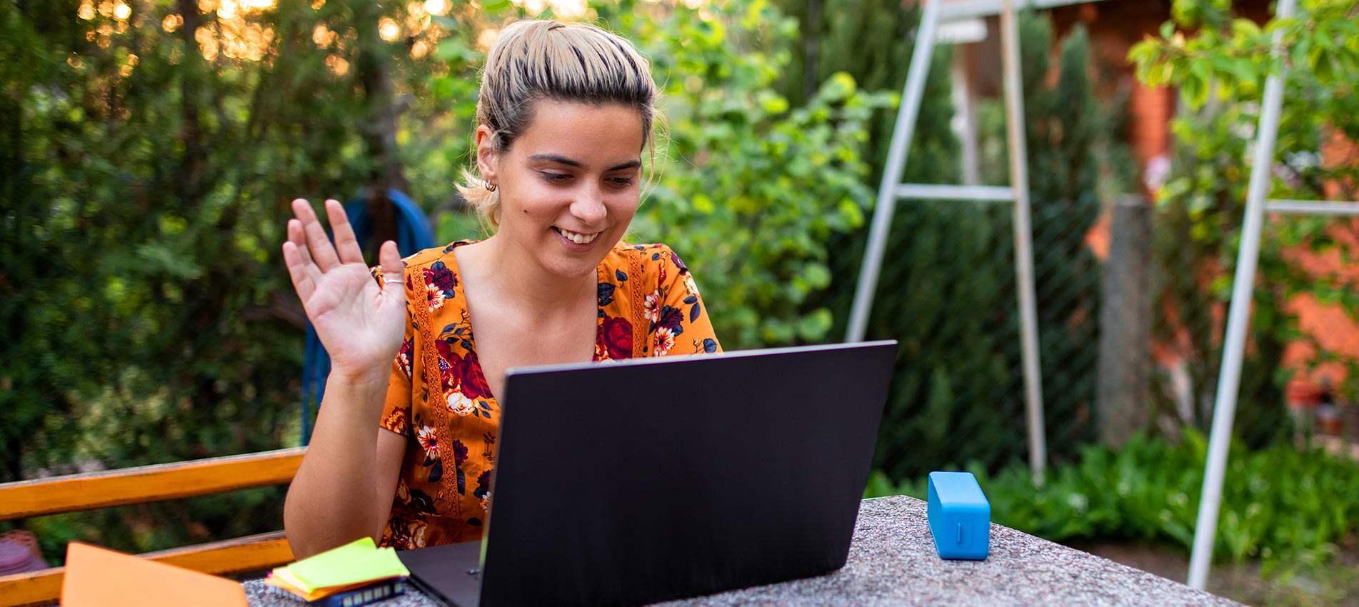 Young Businesswoman Waving During Video Call