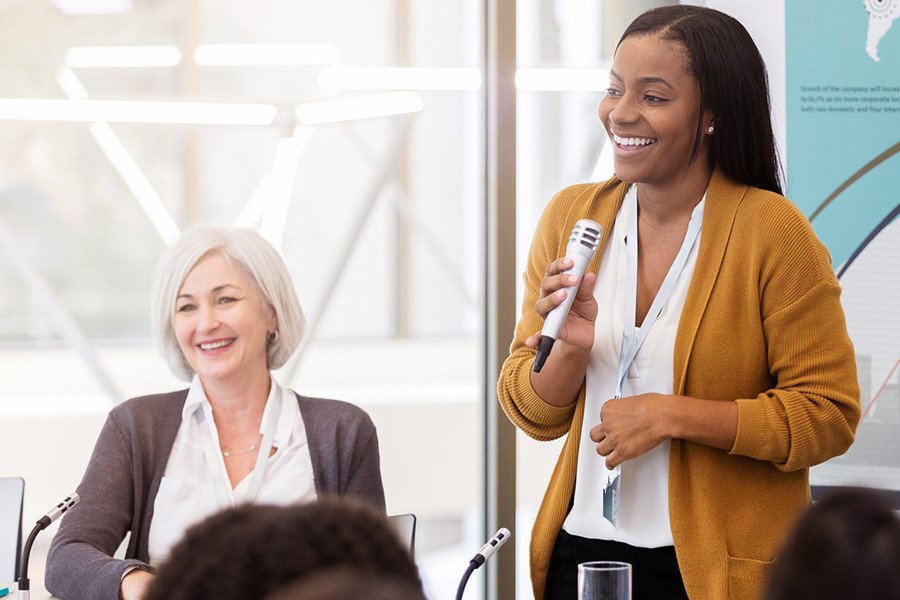 African American Businesswoman Facilitates Panel Discussion